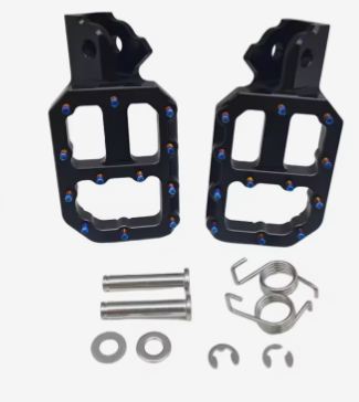 A pair of black metal motorcycle or scooter foot pegs with blue lock nuts, shown with mounting hardware including silver bolts, washers, and clips on a plain white background.